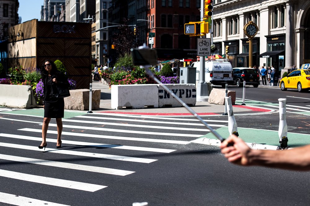 1f94fdcdf080917newsafestreetsflatiron-4-jpg.jpeg A woman uses a new 24th Street crosswalk to cross Broadway. Department of Transportation officials installed the new walkway after closely studying the intersection and finding that thousands of pedestrians each day would venture into traffic and cross at the intersection, despite the previous lack of a signal and crosswalk.</br>