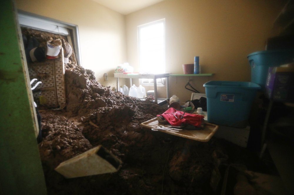 1fdcbababgettyimages-859560190-jpg.jpeg Mud remains in a room of the Reyes family's house after Hurricane Maria hit the island, on October 9, 2017 in Jayuya, Puerto Rico. <br/>