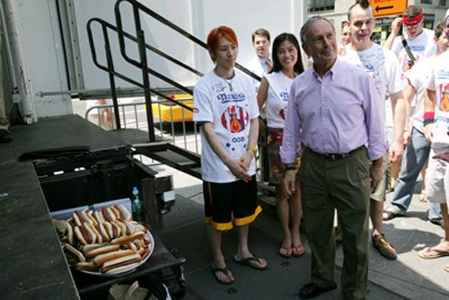 Et tu, trans-fats?  Mayor Bloomberg looks like he's tempted by the hot dogs.