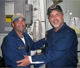 Capt. Richard Phillips, right, stands with U.S. Navy Cmdr. Frank Castellano after the rescue