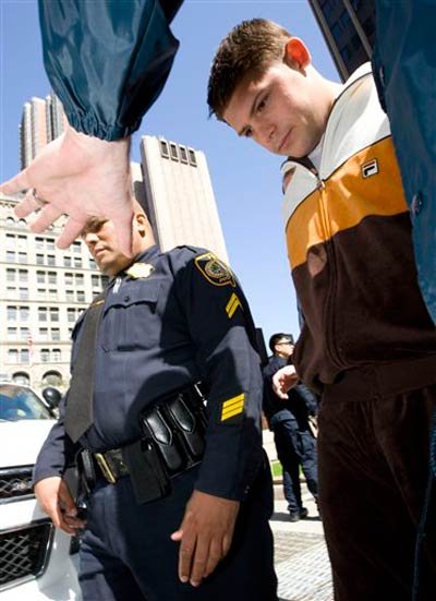 Federal agents escort Michael Scotto from Federal Plaza