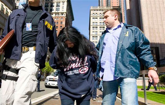 Federal agents escort Suzanne Porcelli, a reputed member of the Gambino organized crime family, from Federal Plaza