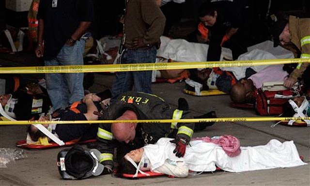 2010_05_sif3.jpg Emergency personnel tend to the wounded