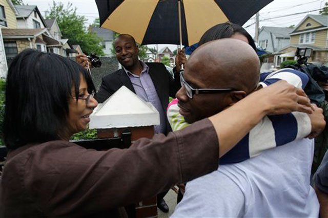 2010_06_jc4.jpg Collins hugs relatives