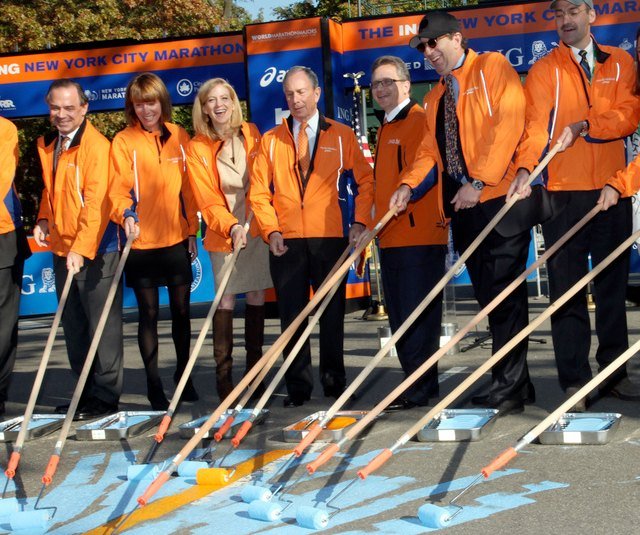 Mayor Bloomberg paints the gold finish line for the NYC Marathon yesterday