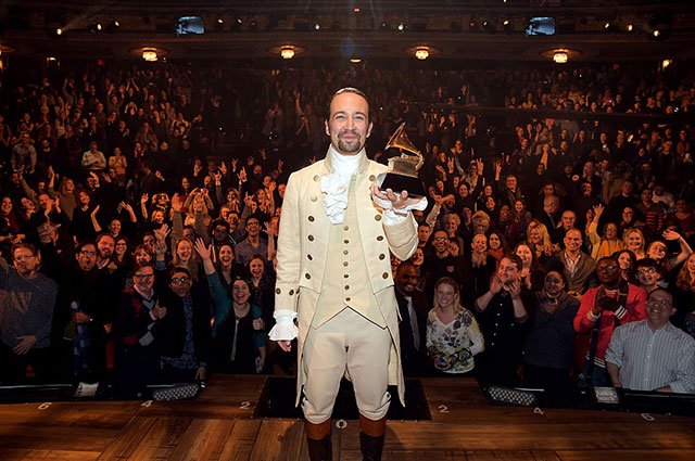 "Hamilton" mastermind Lin-Manuel Miranda celebrates with his Grammy award after a special Grammys performance
