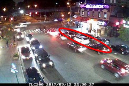Double-parked cars on Dyckman Street in an image from the city Department of Transportation's 2017 plan for new bike lanes.