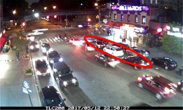 Double-parked cars on Dyckman Street in an image from the city Department of Transportation's 2017 plan for new bike lanes.