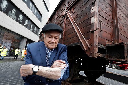 Leon Kaner, 94, shows his tattoo