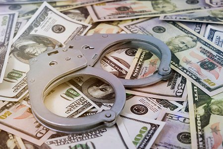 2019_05_moneyhandcuffs1.jpg