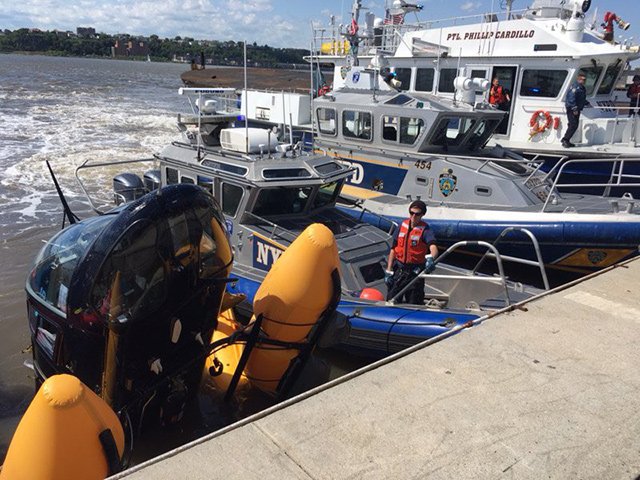 NYPD bring in a helicopter that crashed near Hudson River Park on May 15, 2019.