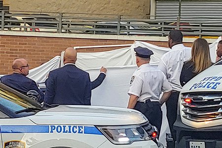 Police surround the car on West Kingsbridge Road