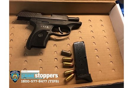 A photograph of the suspect's gun