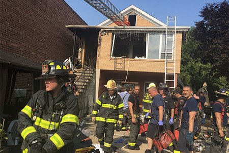 Firefighters at the East Elmhurst house