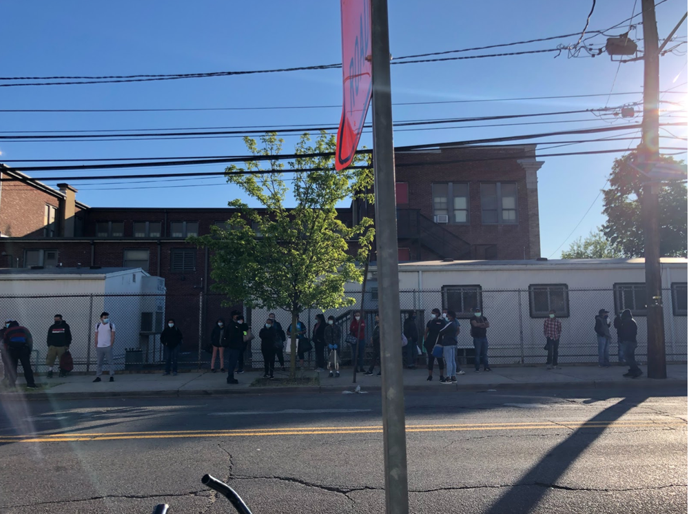 More than a dozen workers wait for their ride outside On Target on a Monday morning.