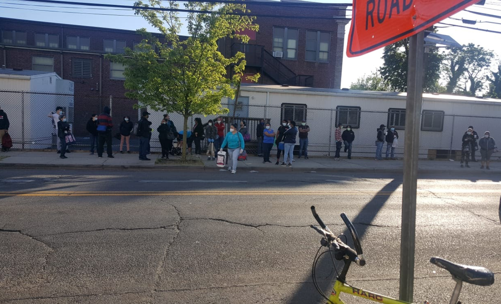 More than a dozen workers wait for their ride outside on Target on a Monday morning.