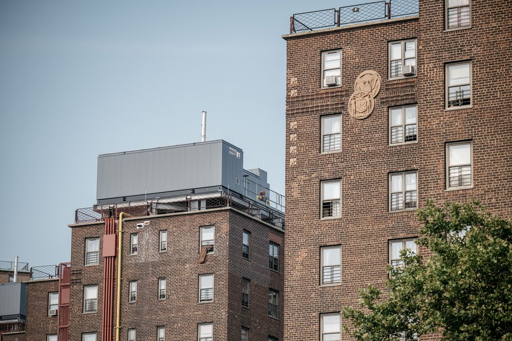 The city installed a rooftop electrical annex (left) at East River Houses to prevent power outages during floods.