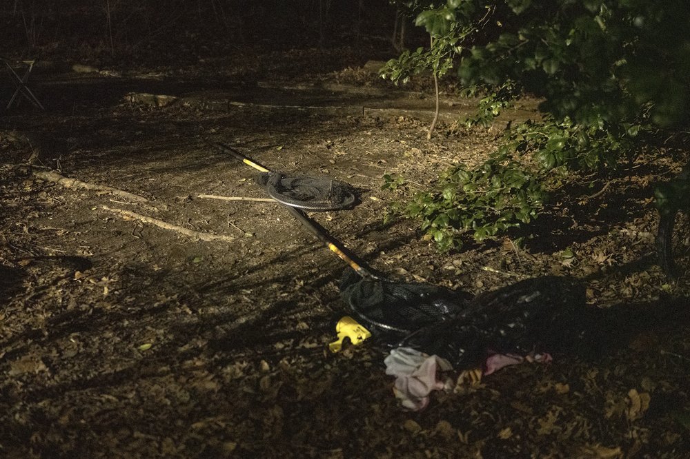 Nets and blankets scattered on the ground.