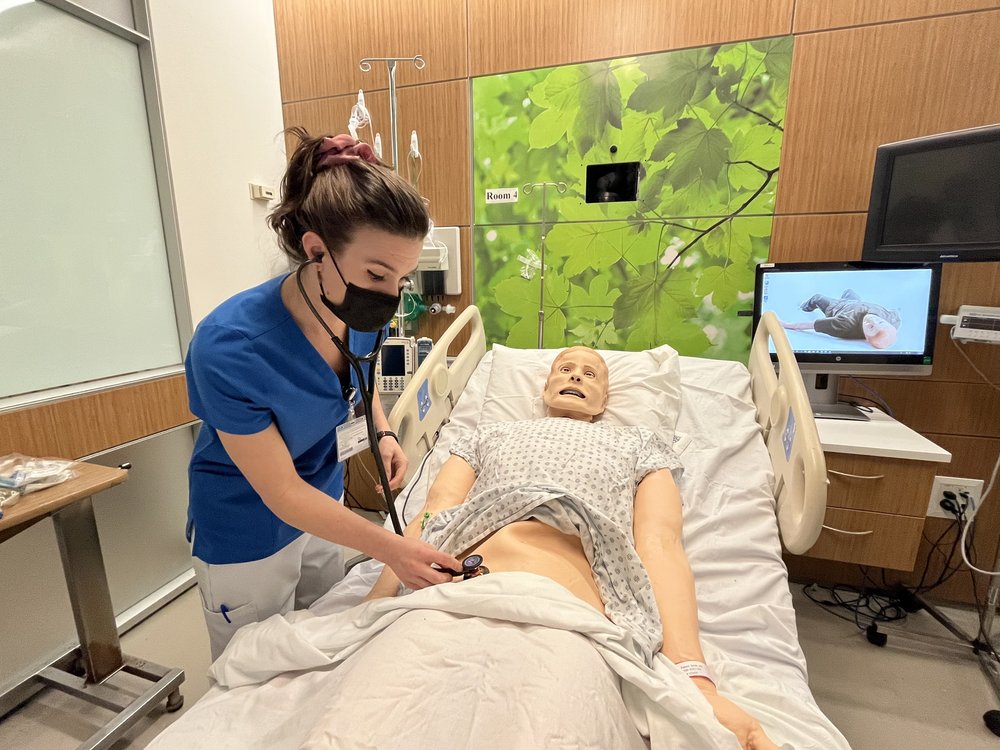 Diane Torcell, 35, practices her nursing skills on a mannequin in the SUNY Downstate College of Nursing’s simulation lab. Torcell says she used to be a pilates instructor, but the pandemic gave her a chance to consider a career change.