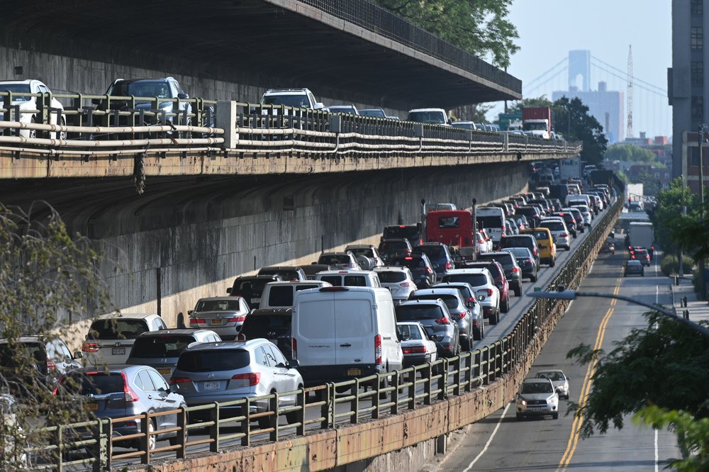 Vehicles drive on the Brooklyn Queens Expressway through Brooklyn Heights, Aug. 6, 2021.