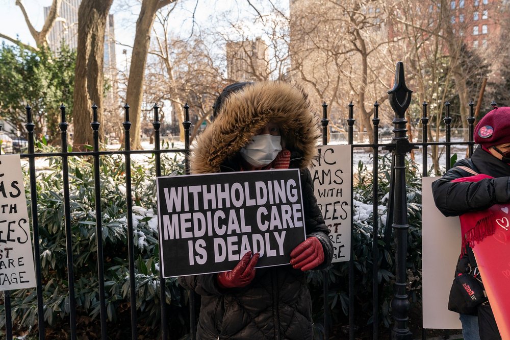 Municipal workers retirees protest proposed changes to medical benefits at City Hall park on Feb. 14, 2022.