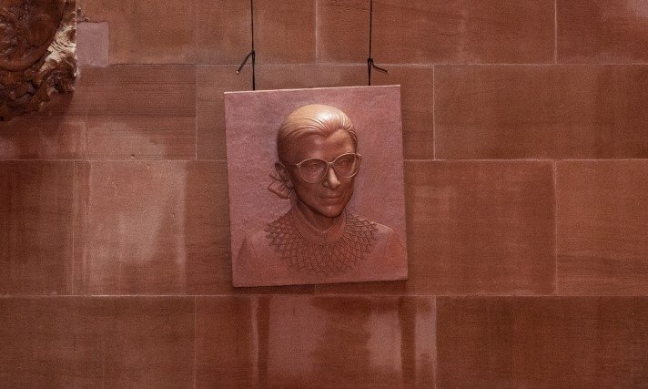 Organizers hold a rehearsal for adding a permanent portrait carving of Supreme Court Justice Ruth Bader Ginsburg to the New York State Capitol’s Great Western Staircase.