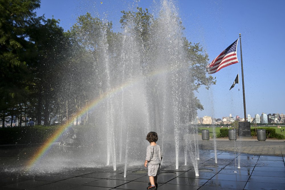 New Yorkers visit a water fountain on July 24, 2023 to get relief from a streak of hot weather.