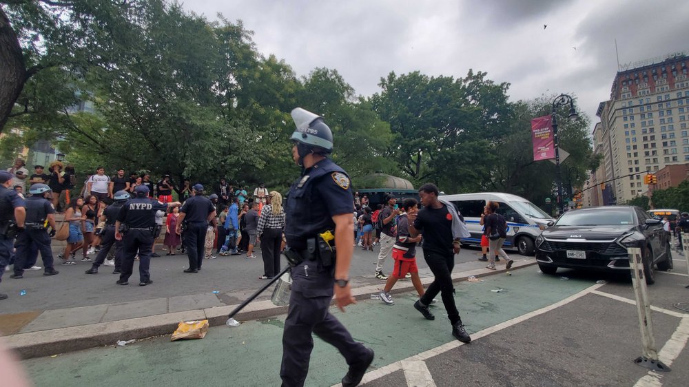 A photo of police trying to corral a raucous crowd at Union Square Friday