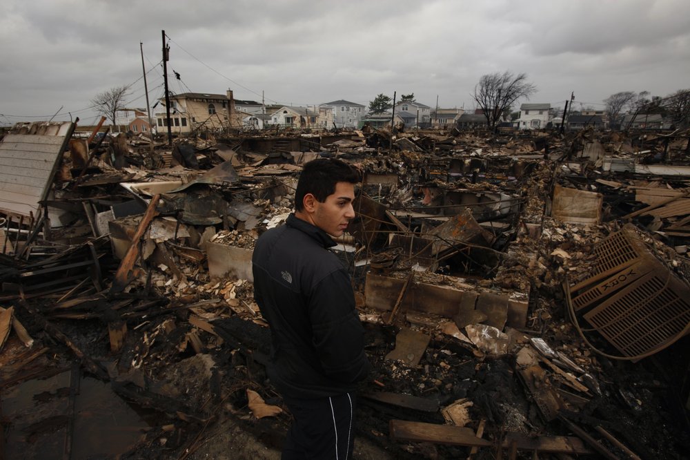 The Breezy Point neighborhood of Queens was devastated by Hurricane Sandy. Beka Baidarashvili, age 18, stands in the area of Breezy Point where more than 50 homes burned to the ground. His parents home in the neighborhood also had major damage.