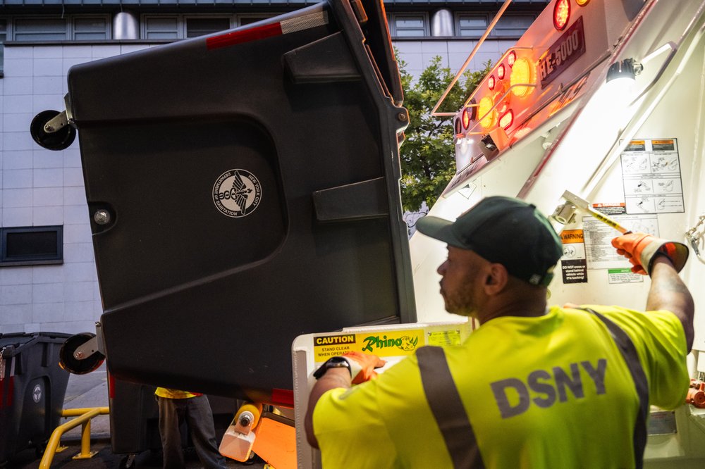 The Sanitation Department modified some trucks from its existing fleet to empty the new bins with a mechanical lift. Photo taken Aug. 16, 2023.