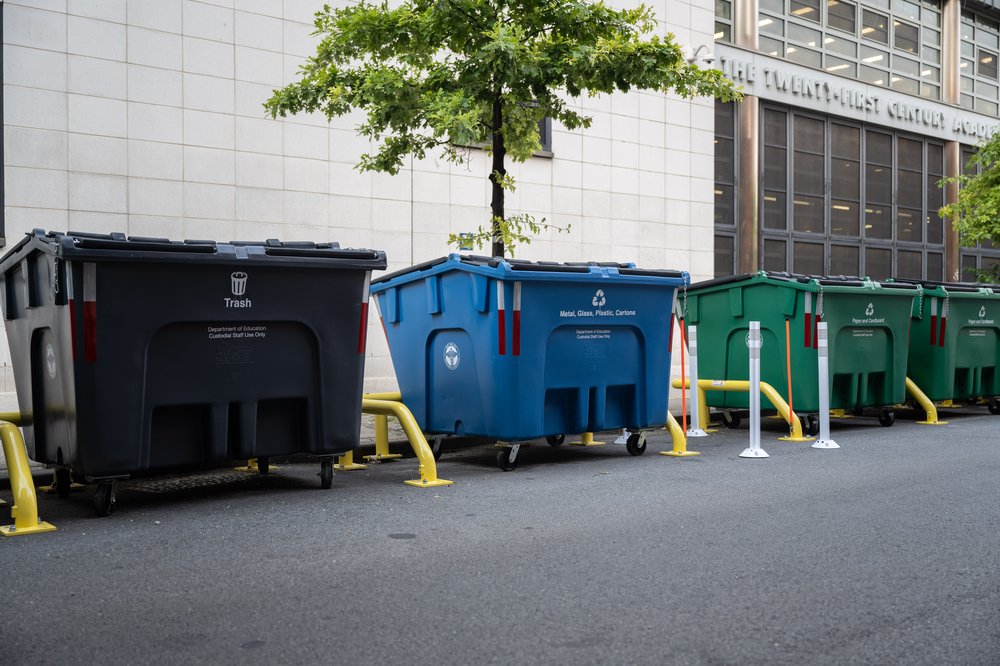 The city is rolling out these container bins to get piles of trash, recycling and compost off the sidewalk and away from rats and pedestrians. The first bins landed in Harlem this week. Photo taken Aug. 16, 2023.