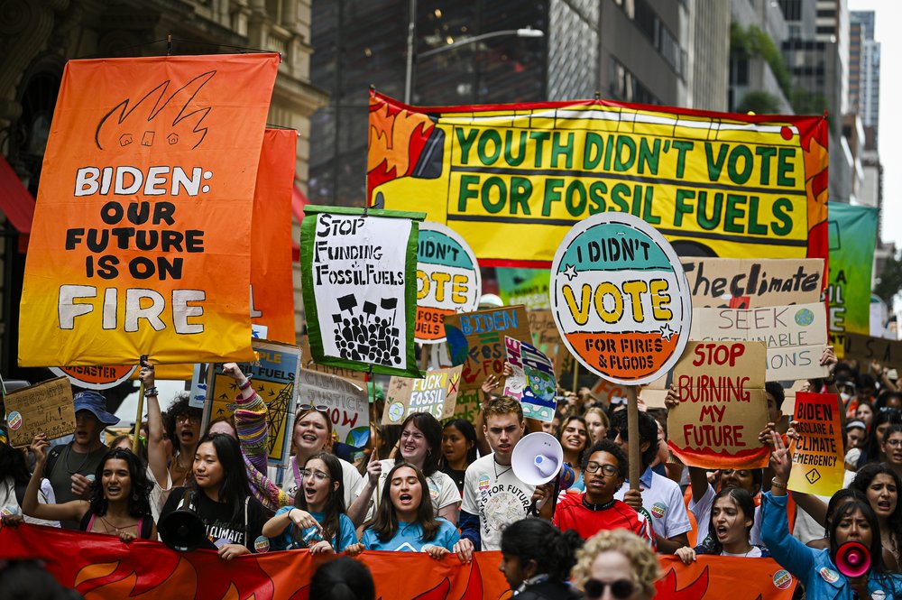 Climate activists attend the march against fossil fuels in midtown Manhattan on Sunday, Sept. 17, 2023. Protesters are rallying again Monday morning in lower Manhattan’s Zuccotti Park, calling on President Biden and financial institutions to stop investments in the fossil fuel industry.