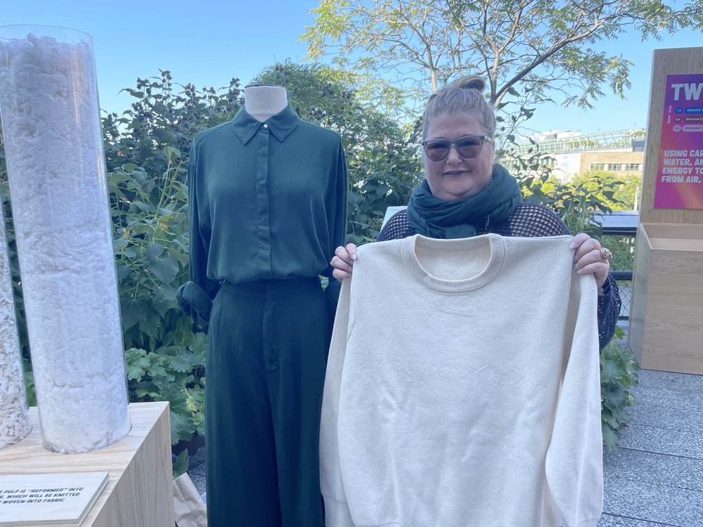 Stacy Flynn is the CEO and founder of Evrnu, a company that takes discarded textiles to make new garments. Next to her is an outfit she produced for Zara.