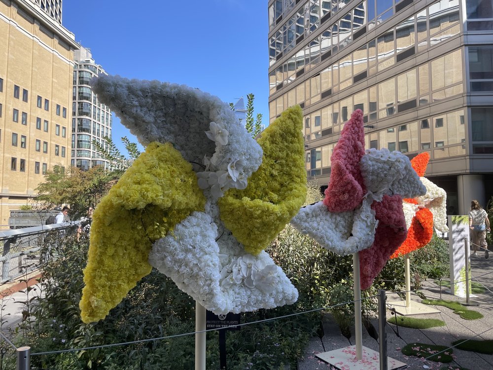 Mr. Flower Fantastic is one of the artists featured at the Climate Science Fair. These pinwheels are made of recycled materials.