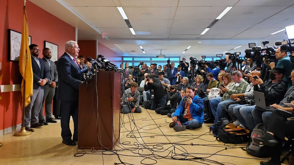 New Jersey Sen. Bob Menendez speaks with a room full of reporters.