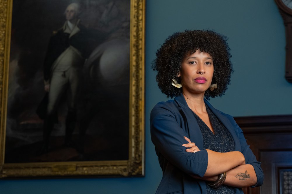NYC Councilmember Sandra Nurse stands in front of a painting of George Washington