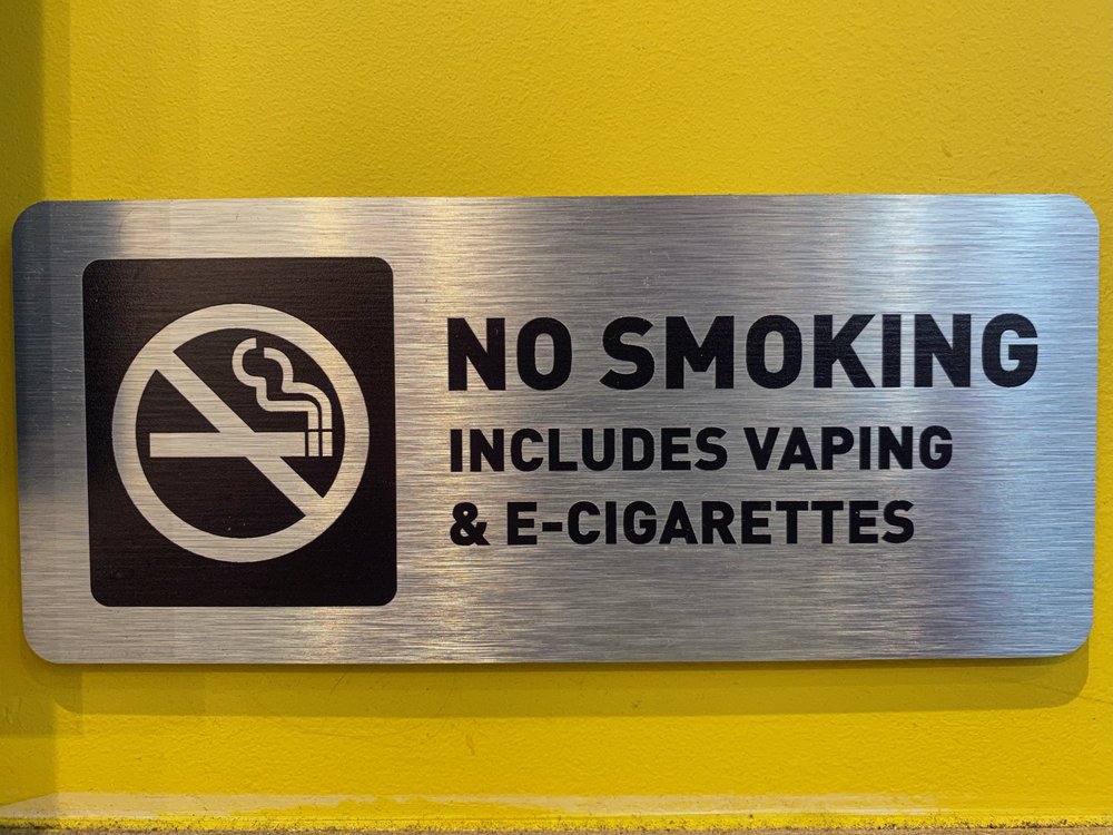 No smoking, including waping and E-cigarettes sign in a Manhattan office building lobby.