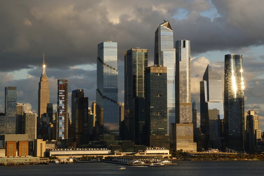 The sun sets on Hudson Yards and the Empire State Building in New York City on Oct. 8, 2023
