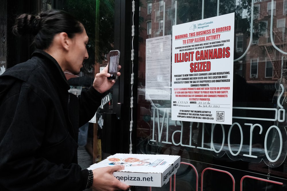 A state of New York notice posted at a business announces the seizure of 'illicit cannabis' at the business as authorities crack down on unlicensed smoke shops on June 16, 2023 in New York City.