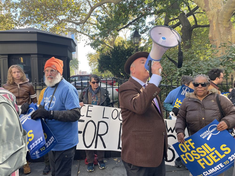 Eric Weltman, senior organizer for Food & Water Watch, addresses the crowd at the Local Law 97 rally.