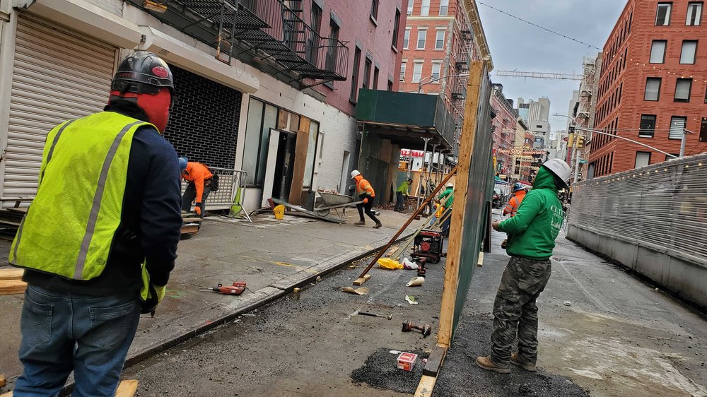 workers at building collapse in little italy