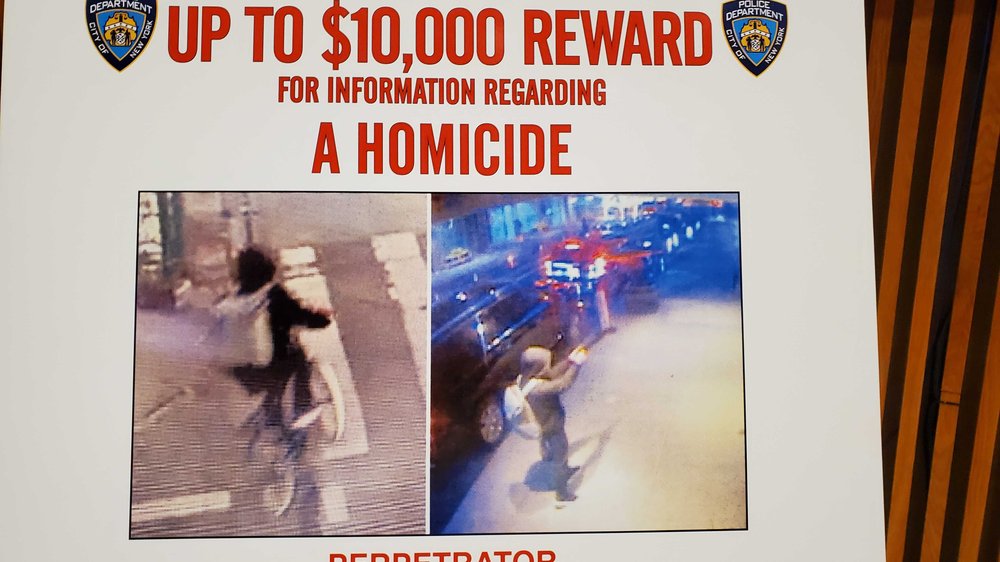 An NYPD wanted poster showing images of a man dressed in all black with a light backpack. The NYPD is offering a $10,000 reward for information after UnitedHealthcare CEO Brian Thompson was shot and killed on 6th Avenue Wednesday morning.