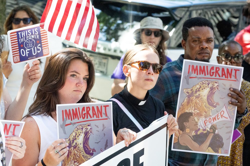 Supporters rally outside a federal courthouse in Newark, where Rep. LaMonica McIver pleaded not guilty to charges that allege she interfered with federal agents' arrest of Newark Mayor Ras Baraka.