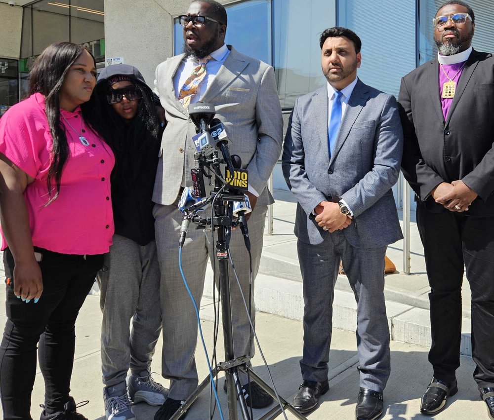 Octavia Roane; Cierra Carroll; the Rev. Kevin McCall; Shiraz Kha; and Bishop Boyde Singletary, founder of the Alpha & Omega church at a press conference Friday afternoon.