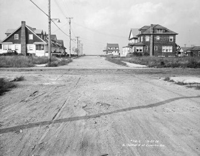 20512oldrock.jpeg "Beach 136th Street, north at Cranston Avenue. Road and houses"