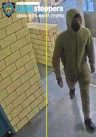 A surveillance image of the other man police say robbed the woman in the incident