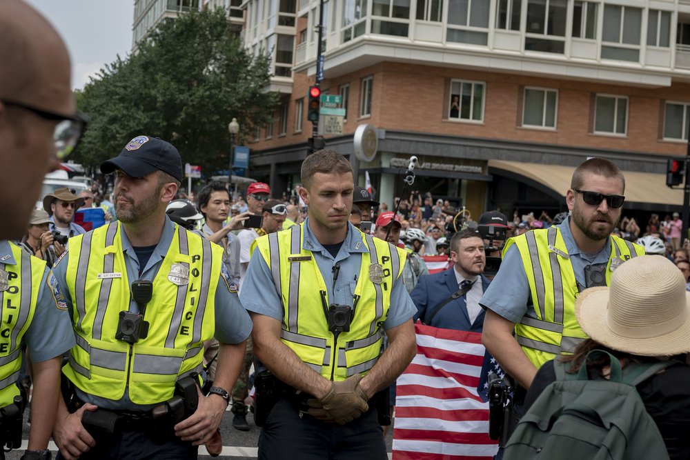 Jason Kessler, holding a flag<br>
