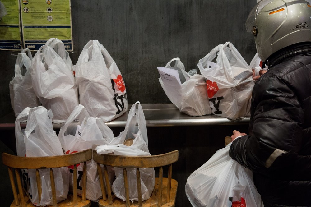 25f20ef7c2018-01-13_heinsebikedigital-9-jpg.jpeg Zhu is one of four deliverymen who ferry between 100 and 150 orders to customers over the course of a typical day. Here, orders are sorted roughly by the cardinal directions, and the delivery cyclists take as many as they can. A clerk estimated that between 80 and 90 percent of the orders come through Seamless.<br/>
