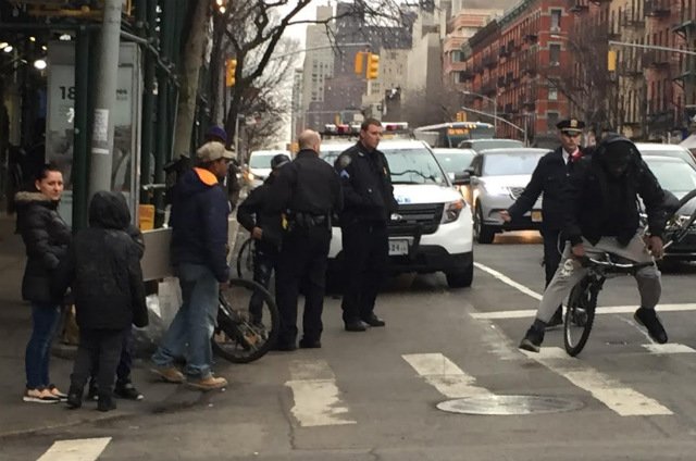 2719cyclist.jpg An NYPD officer shoves a bicyclist off his bike to give him a ticket, according to a witness.