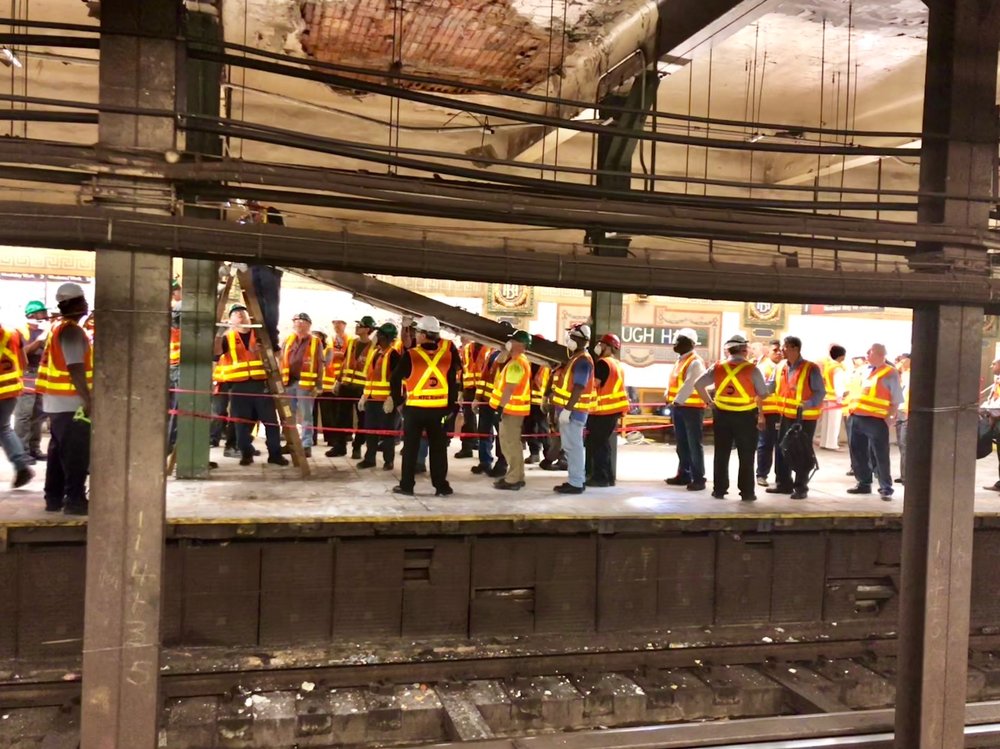 273924491img_0843-jpg.jpeg Workers trying to fix the ceiling (Photograph by Tina Allen)